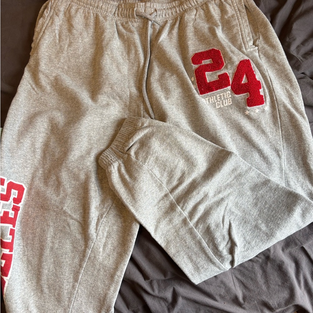 5/45$ or 10/80$

Gray Sweatpants with Red Athletic Print